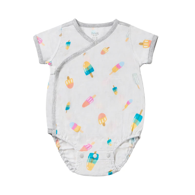 Nest Designs bamboo short sleeve kimono onesie in white with colorful popsicle print; side-snap design and bottom snaps.