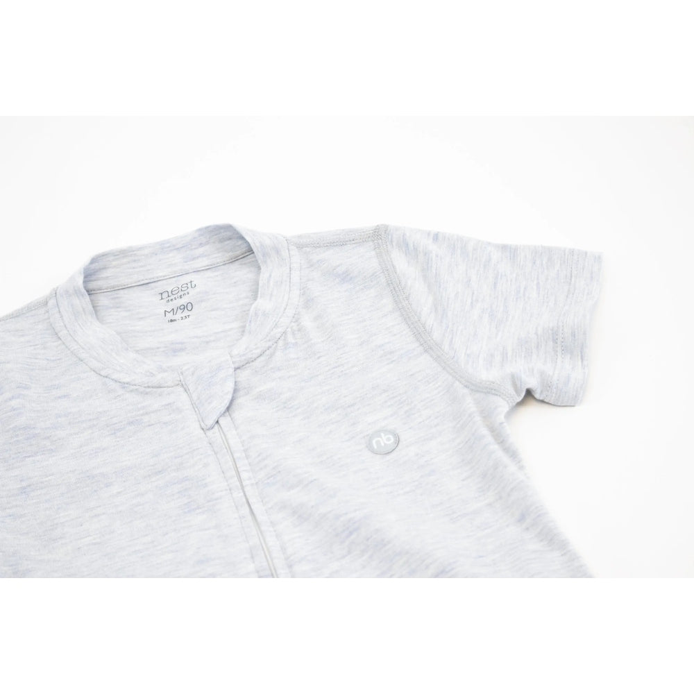 Nest Designs Basics bamboo cotton short-sleeve drop-bottom romper in Grey Dawn, shown with a front zipper for quick diaper changes.