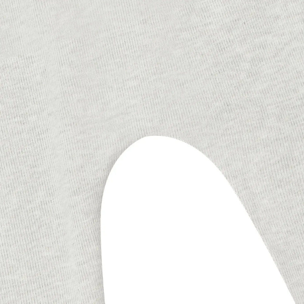 Nest Designs Basics Organic Cotton 3-Piece Baby Gift Set in light grey, soft fabric draped with a white curved cutout.