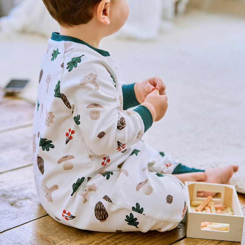 Nest Designs cotton long-sleeve footed sleep bag in forest forage print for babies.