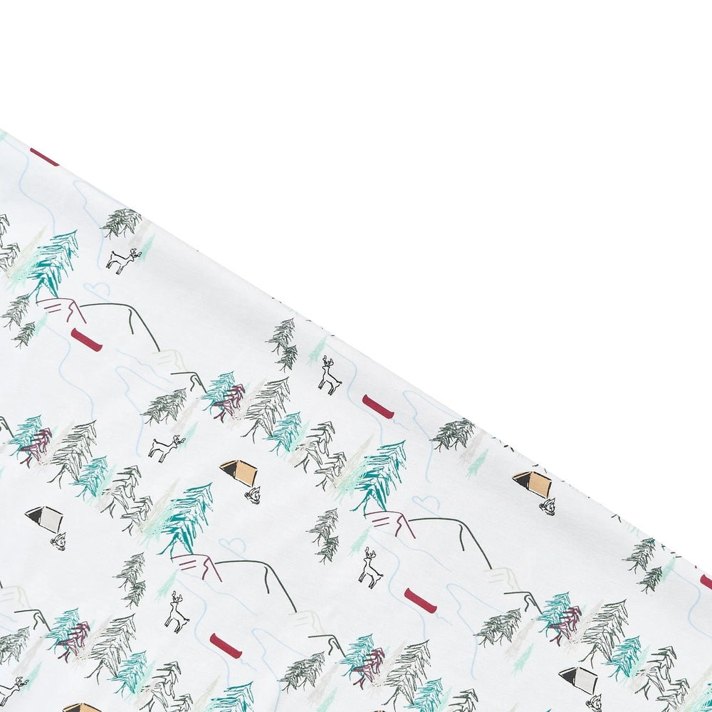 Nest Designs Cotton Waterproof Baby Change Pad Forest Fun, white with teal trees and tents, waterproof surface visible.