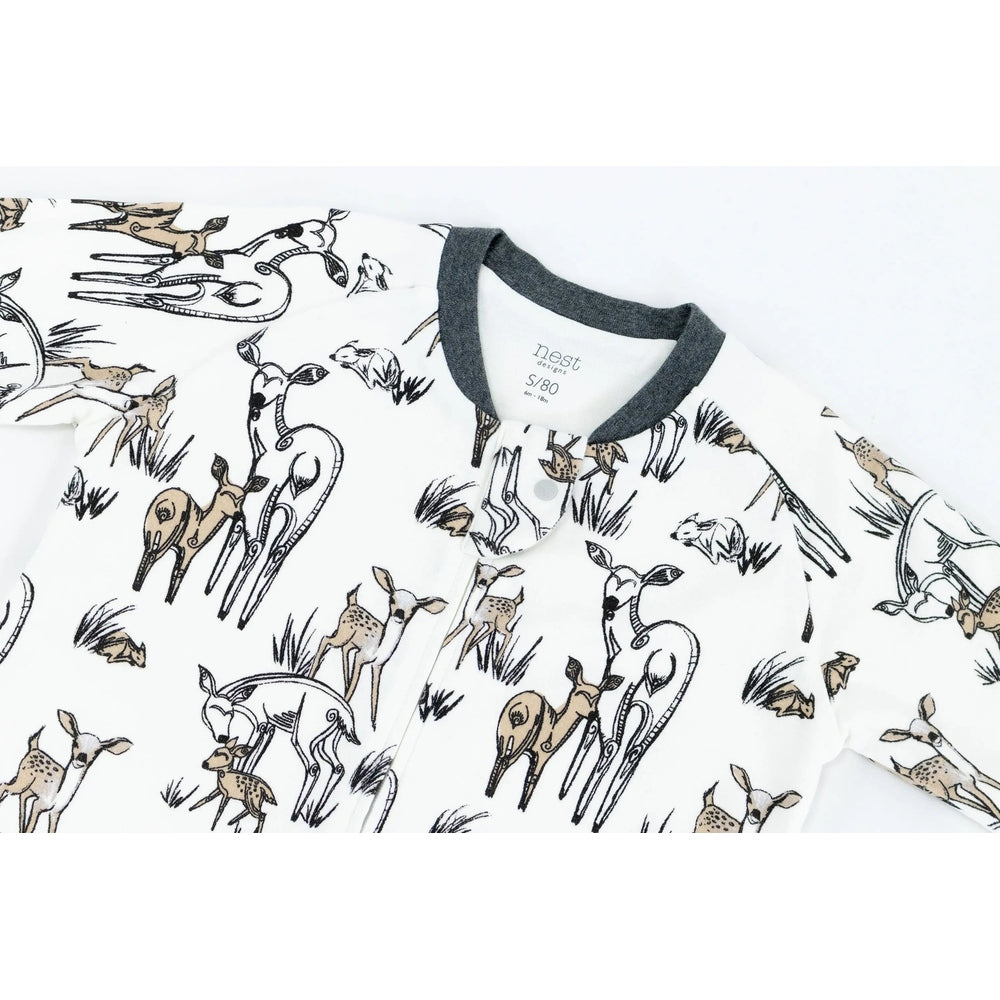 Nest Designs Organic Cotton Long Sleeve Sleep Suit 1.0 Tog in white with deer print, laid flat to show soft fabric.