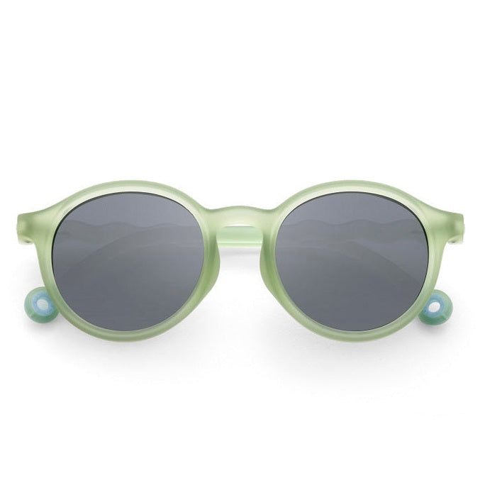 OLIVIO & CO Junior+ Oval Sunglasses in light leaf green with gray lenses and solid plastic frame.