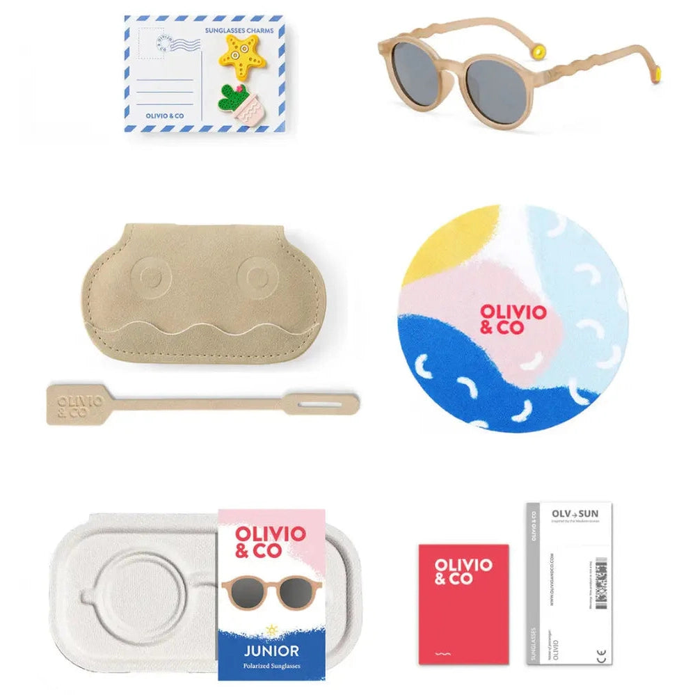 Olivio & Co Oval Sunglasses Junior+ Classic Olivio Sand Beige shown with beige case and cleaning tool.