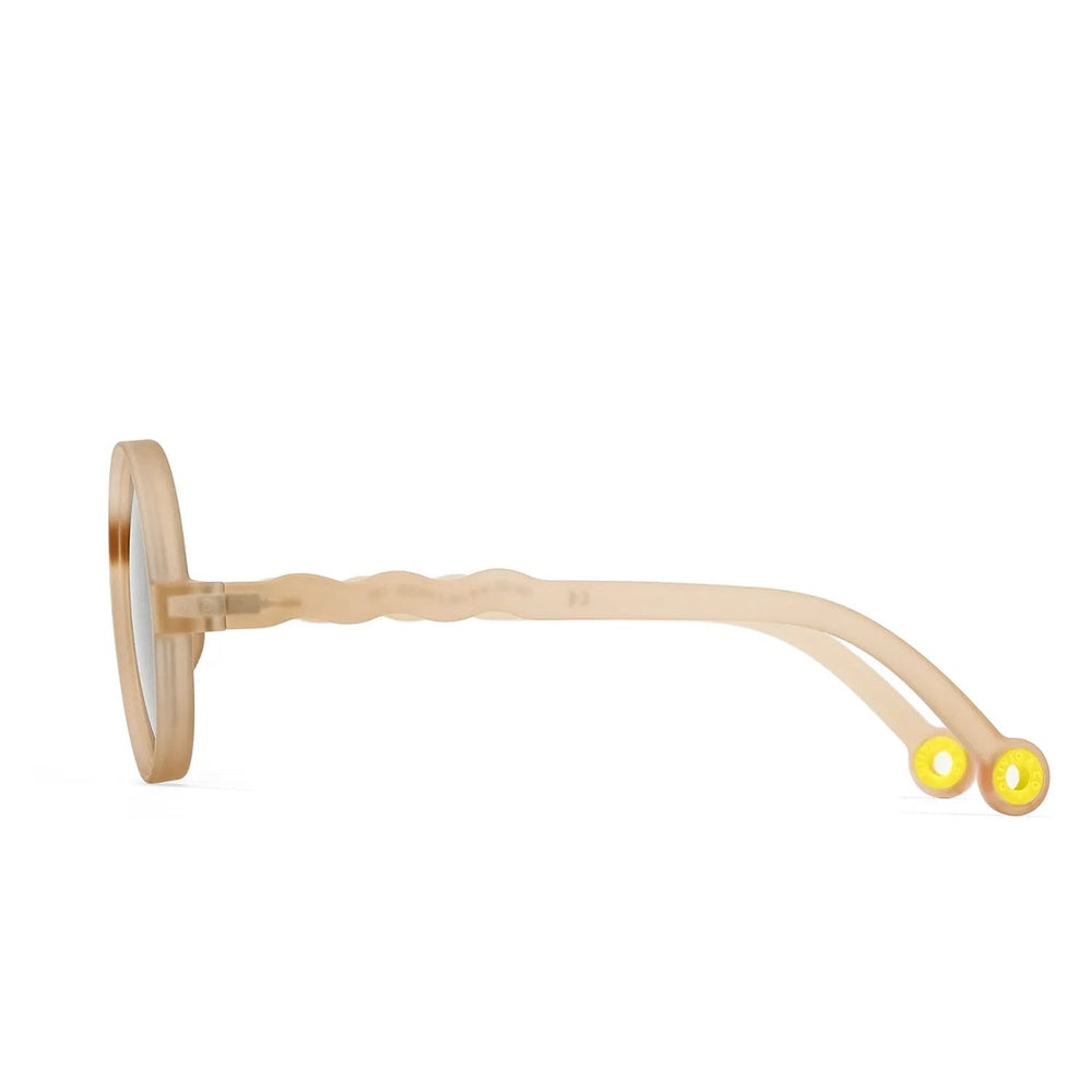 Olivio & Co Round Sunglasses Kids sand beige frames shown in side profile, waved arms, yellow temple tips