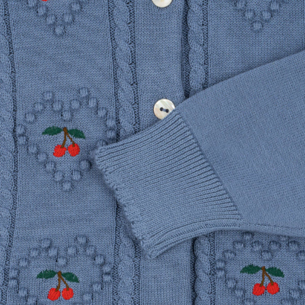 Konges Sløjd Soleil cardigan in country blue knit with cherry embroidery and pearl buttons.