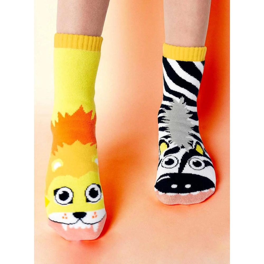 Pals Socks New Lion & Zebra Pals mismatched kids socks, left yellow lion design and right zebra pattern.