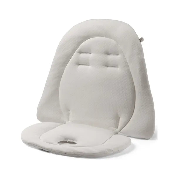 Peg Perego Baby Cushion in white plush with head support, shown ready to install in a stroller.