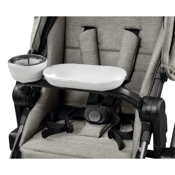 Peg Perego Child's Tray YPSI/Z4 attached to a gray stroller, showing a white tray with drink cup holder.