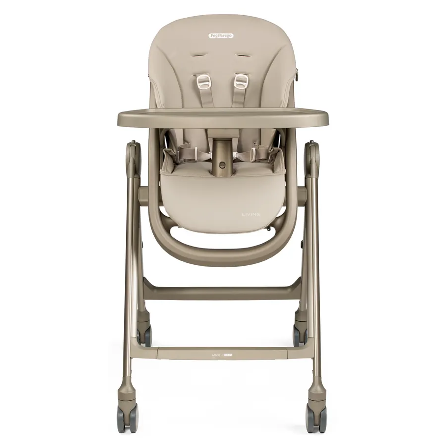 Peg Perego Living High Chair in beige with adjustable tray and 5-point harness on a wheeled frame.