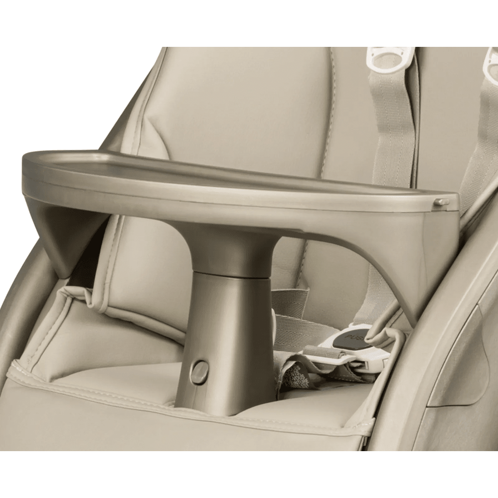 Peg Perego Living High Chair in beige with a wide, attached tray and secure harness shown in use.