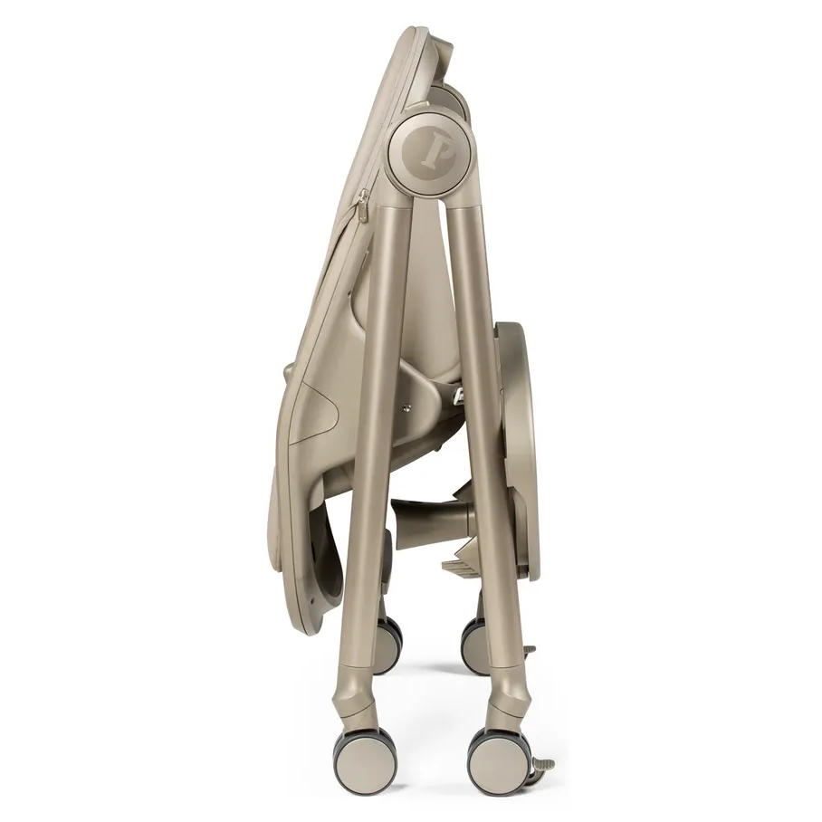 Peg Perego Living High Chair, beige foldable high chair shown folded with wheels for easy storage.