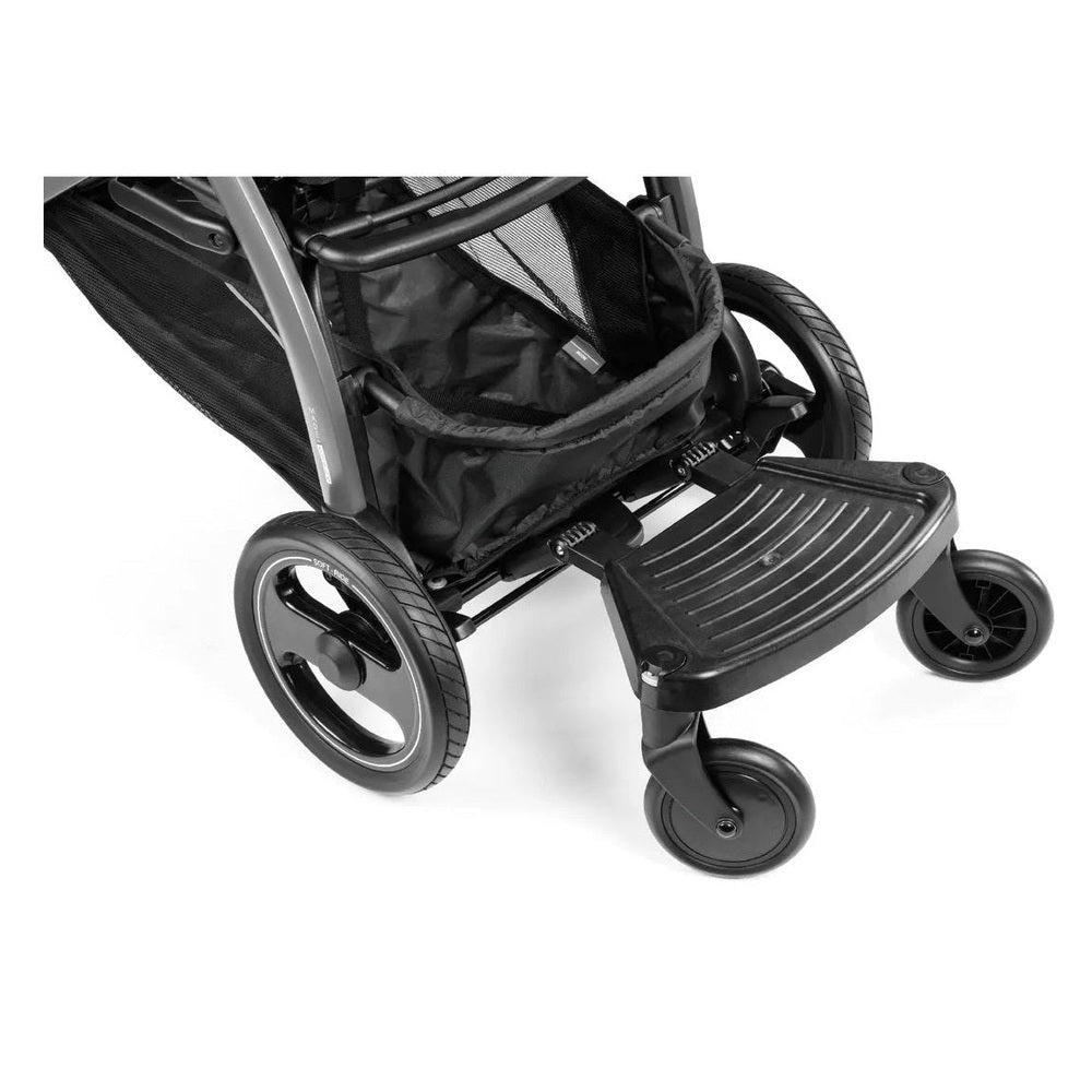 Peg Perego Ride with Me Board, black, showing the front-step platform attached to a stroller for an older child.