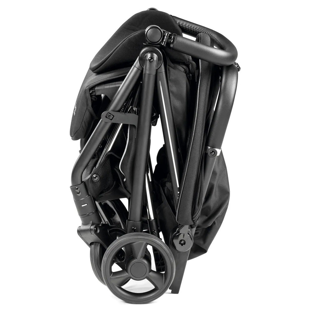 Peg Perego Selfie Plus Stroller folded compactly, black fabric with alloy frame for easy storage