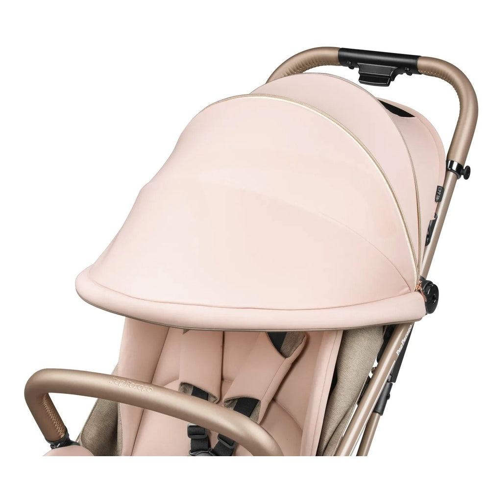 Peg Perego Selfie Plus Stroller in blush pink with beige frame and extended canopy.