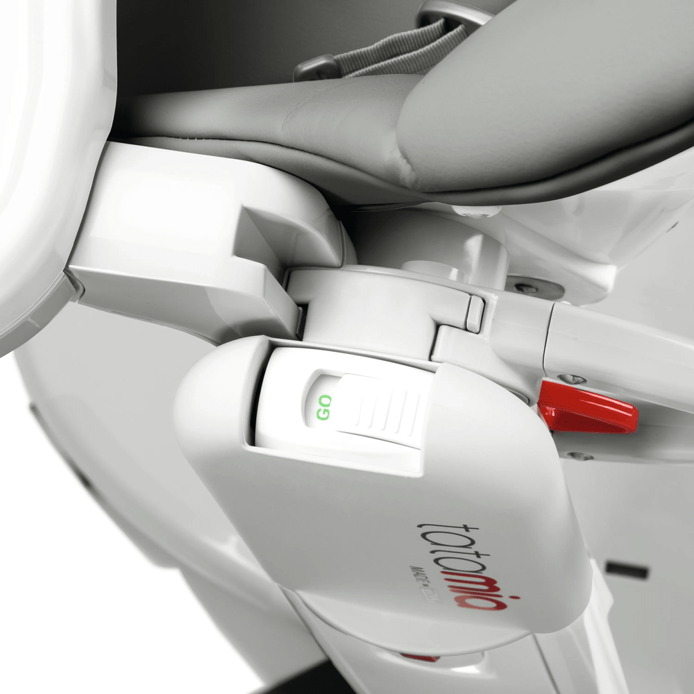 Peg Perego Tatamia High Chair, white/gray, with a green GO lever and reclining hinge in action.