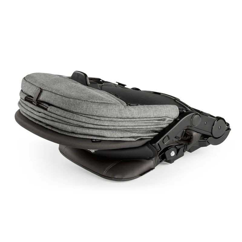Peg Perego Triplette Piroet seat, grey fabric with black frame, folded for compact storage.