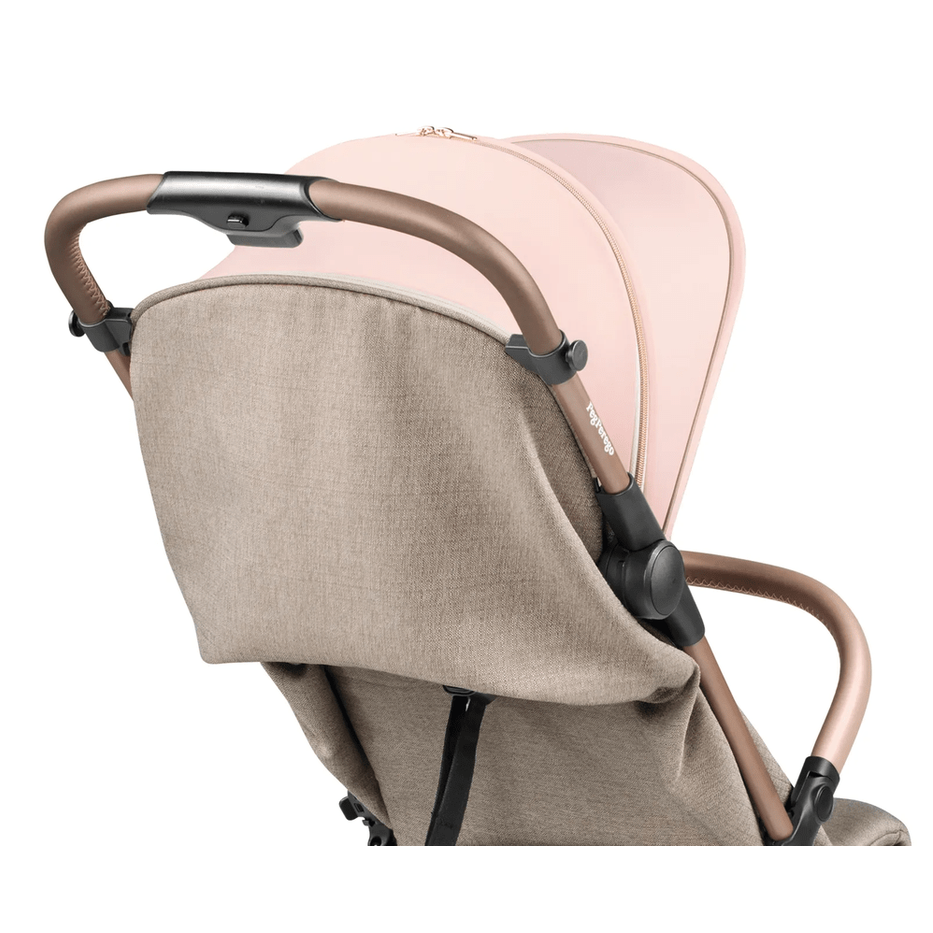 Peg Perego VOLO Travel Stroller in beige fabric with brown handlebar and pink canopy, showcasing its sturdy frame.