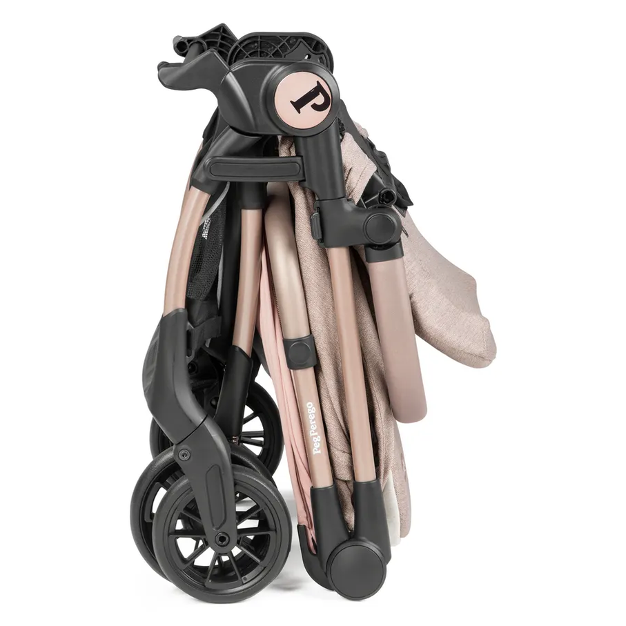 Peg Perego VOLO Travel Stroller, rose-gold frame, folded with wheels tucked, ready to carry.