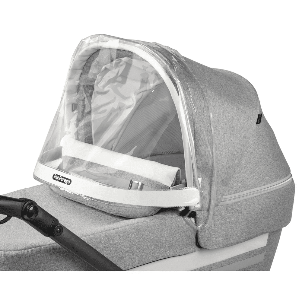 Peg Perego Visor for Stroller/Bassinet shields a gray bassinet with a clear plastic canopy attached over the frame.