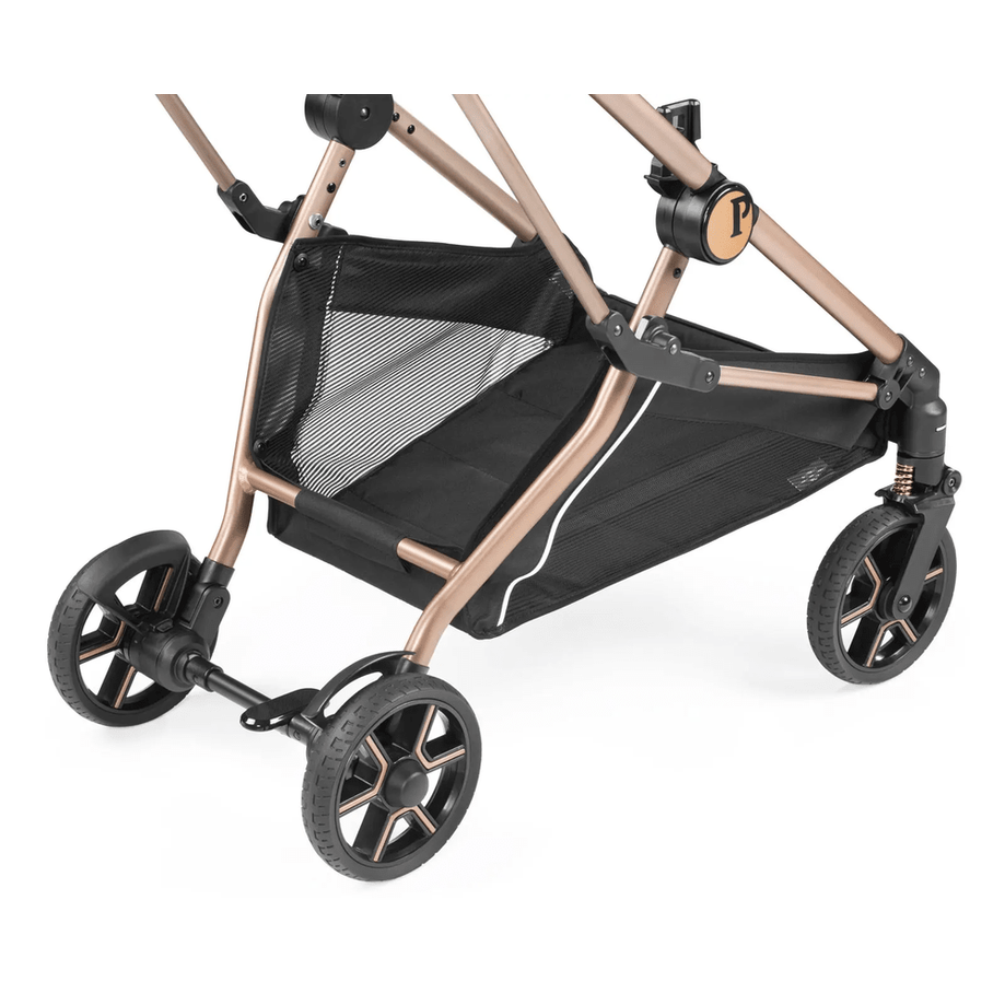 Peg Perego Vivace Stroller with rose-gold frame and black mesh basket, showing large wheels and foot muff.