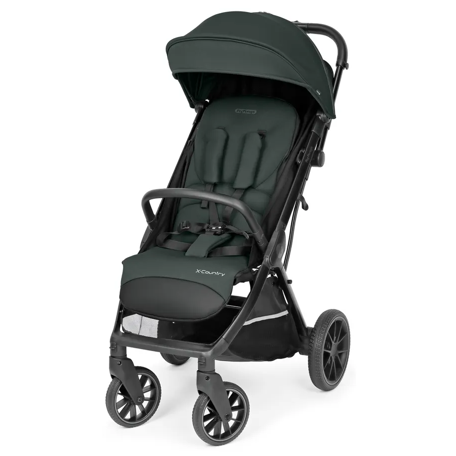 Peg Perego X-Country Travel Stroller in dark green with large canopy, padded harness, and four-wheel chassis.