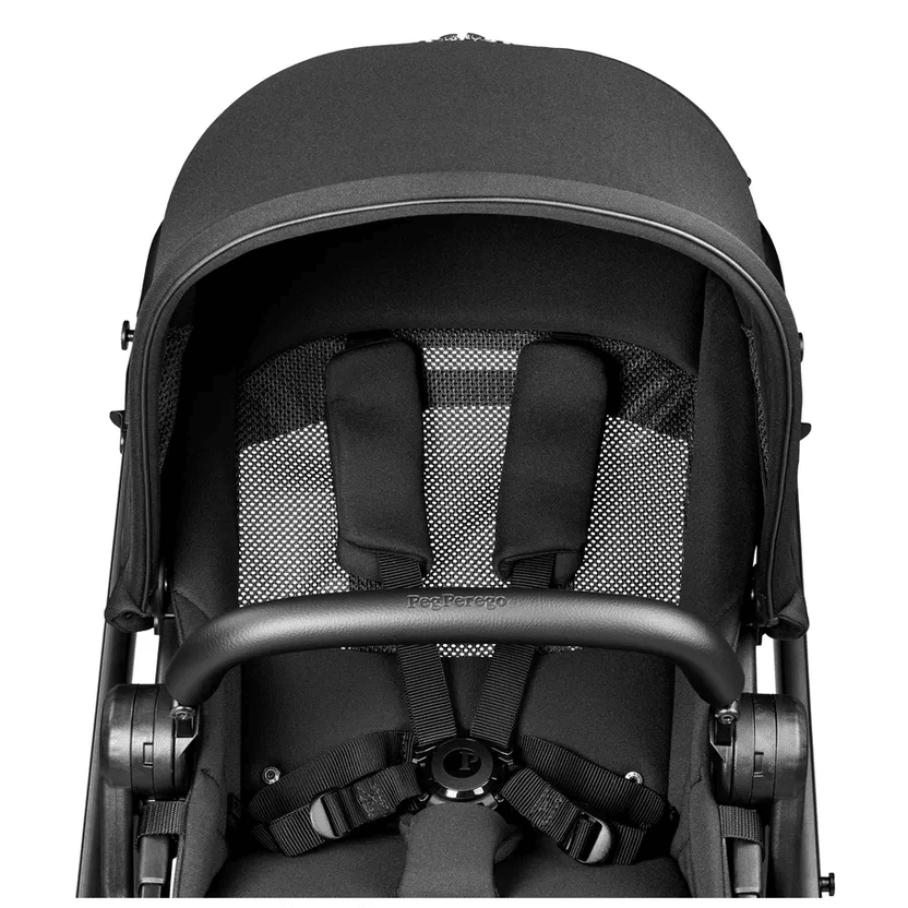 Peg Perego YPSI Companion Seat in black, where a secure five-point harness clips over padded shoulders.