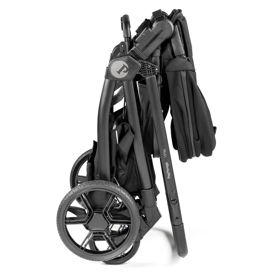 Peg Perego YPSI Companion Seat folded in black with large wheels, compact travel stroller accessory.