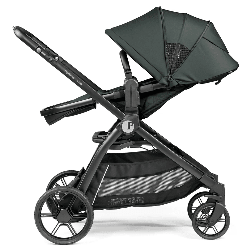 Peg Perego YPSI Travel System stroller in dark green canopy, black frame, and large storage basket (side view).