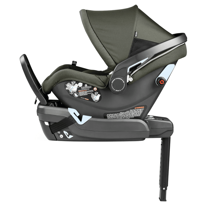 Peg Perego YPSI Travel System infant car seat in olive green secured on the base with adjustable support leg.