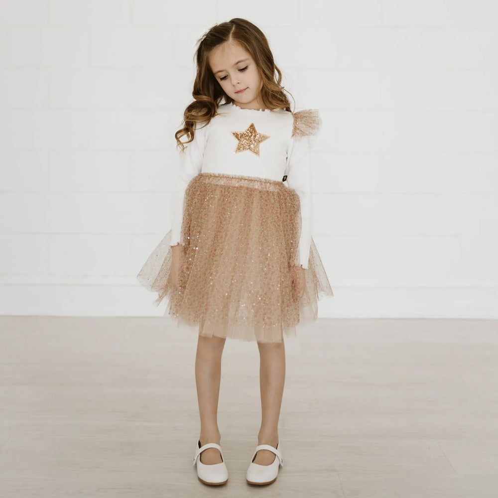 Petite Hailey Frill Flower Tutu dress, white top with gold star and rose-gold sequined tutu, girl posing.