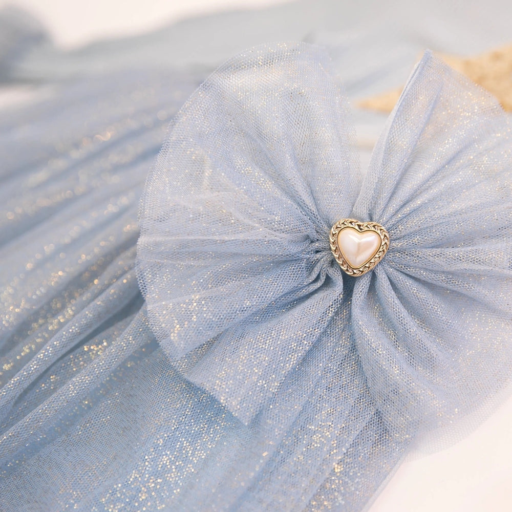Petite Hailey Sleeve Tutu Headband in blue glitter tulle with a heart centerpiece and delicate gathered bow
