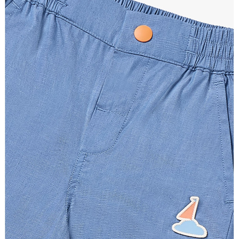 Petite Revery denim jeans sky blue for babies with elastic waistband, orange snap, pastel cloud patch