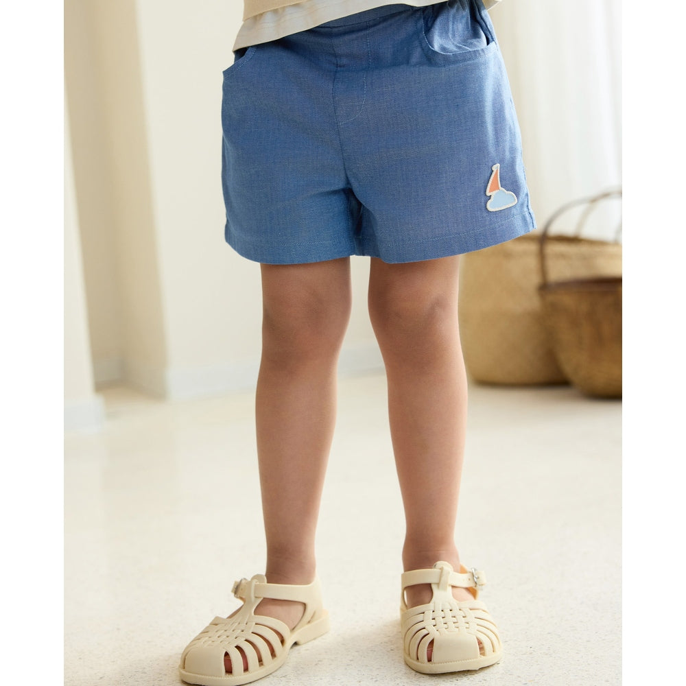 Petite Revery Denim Shorts Sky for toddlers, blue denim with sailboat patch