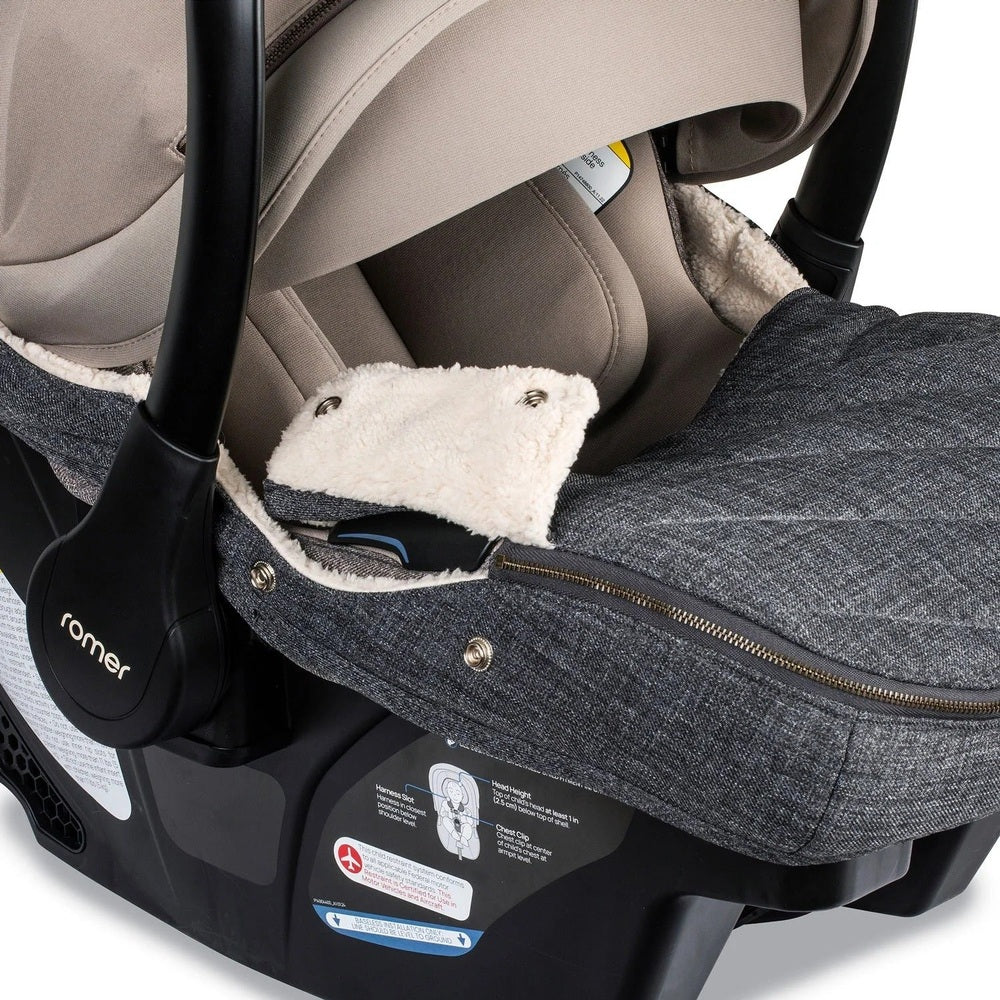 Romer Juni Winter Cover stroller footmuff in grey fleece, zipped closed for warmth on a stroller.