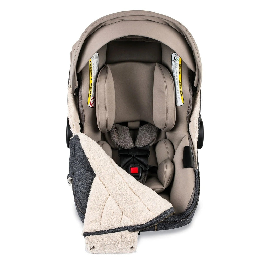 ROMER Romer Juni Winter Cover footmuff in beige fleece, shown attached to a stroller for warmth.