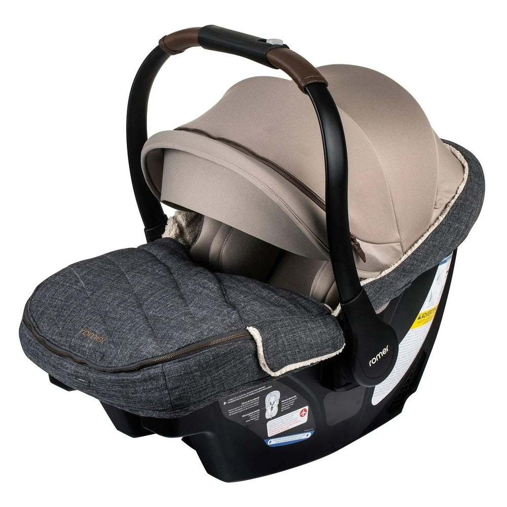Romer Juni Winter Cover footmuff attached to a baby car seat, charcoal-gray fabric with plush lining and zipper.