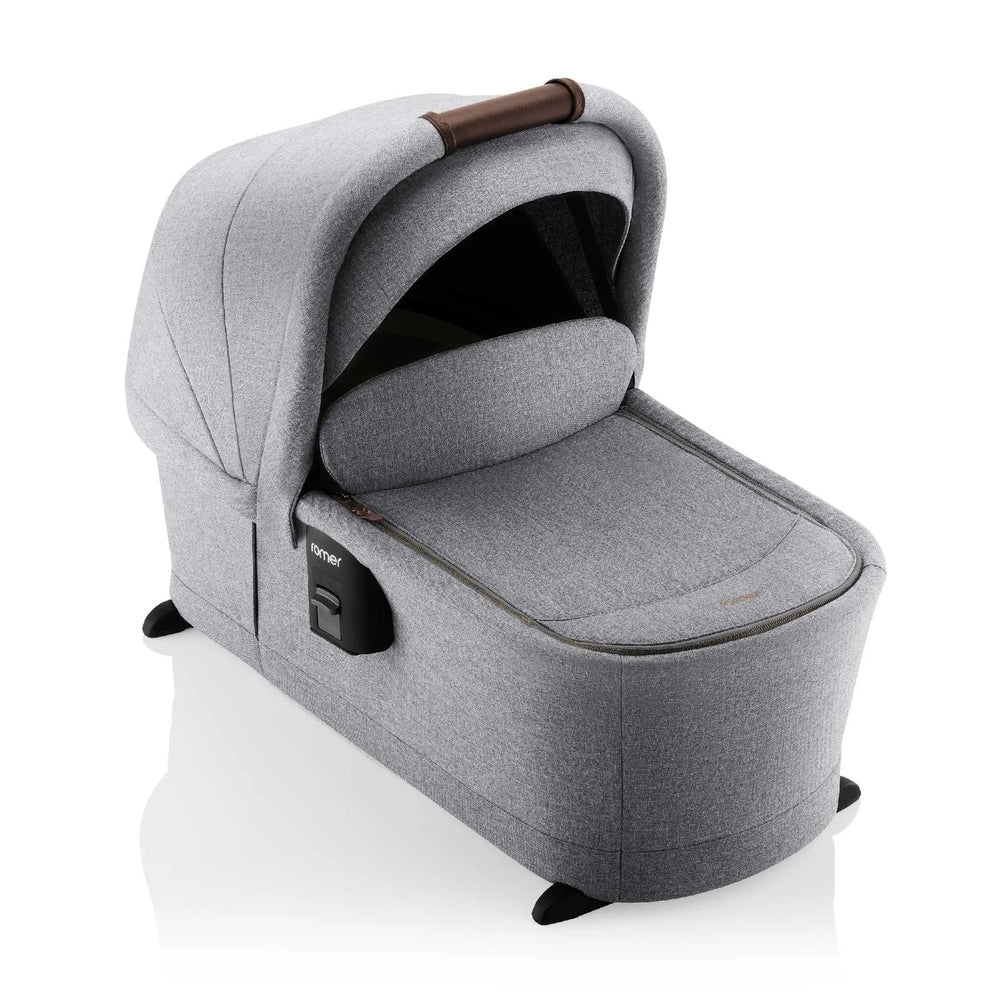 Romer Sera Bassinet for Tura Stroller in gray fabric with padded canopy, ready to cradle a newborn.