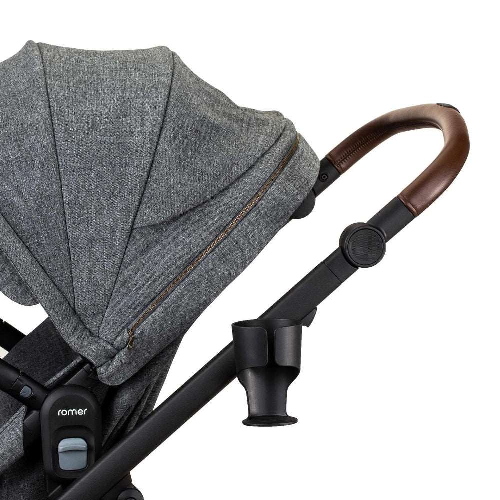 ROMER Romer Tura Cup Holder mounted on a gray stroller frame with brown handle grip.