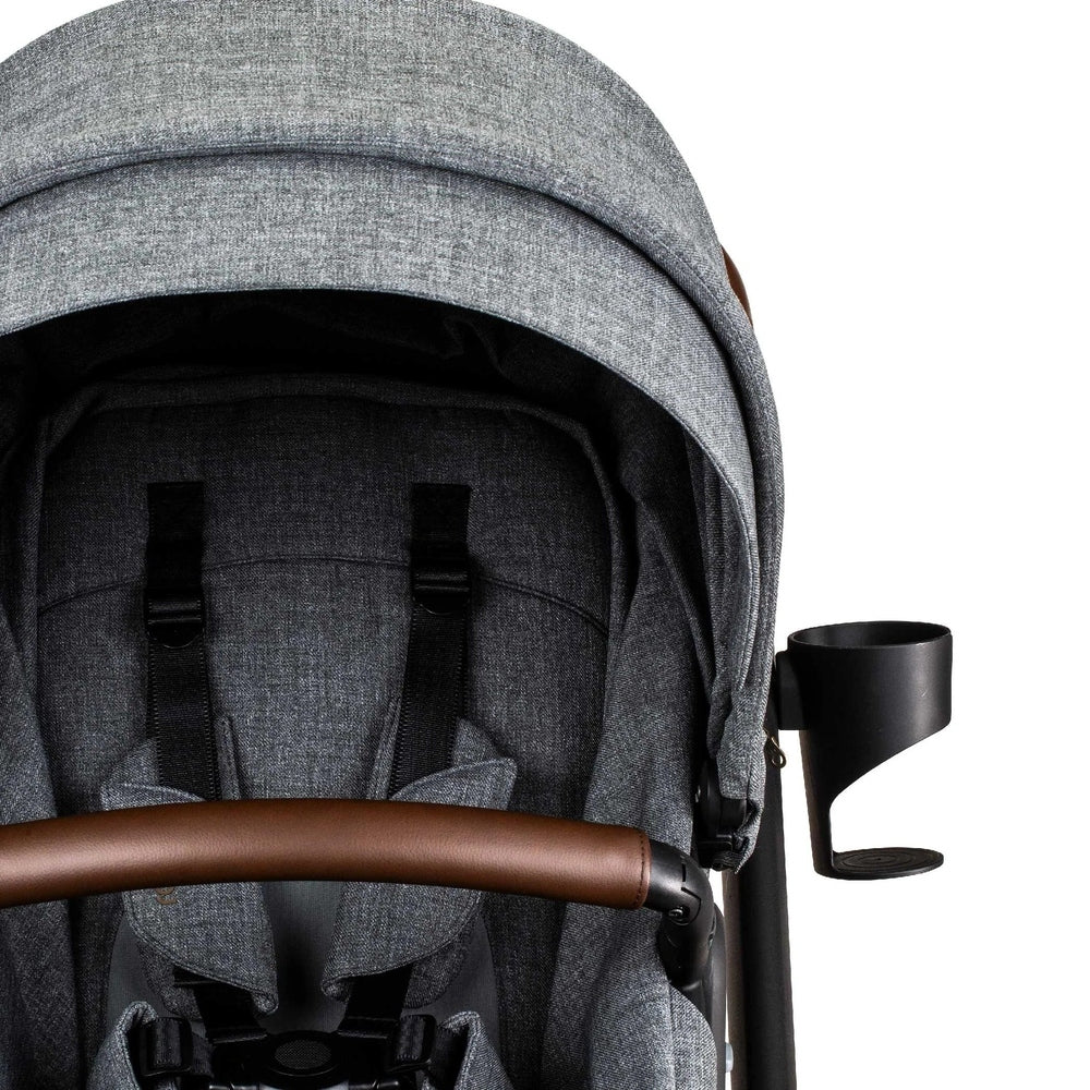 Romer Tura Cup Holder mounted on ROMER stroller, black cup holder with curved support beside the grey frame.