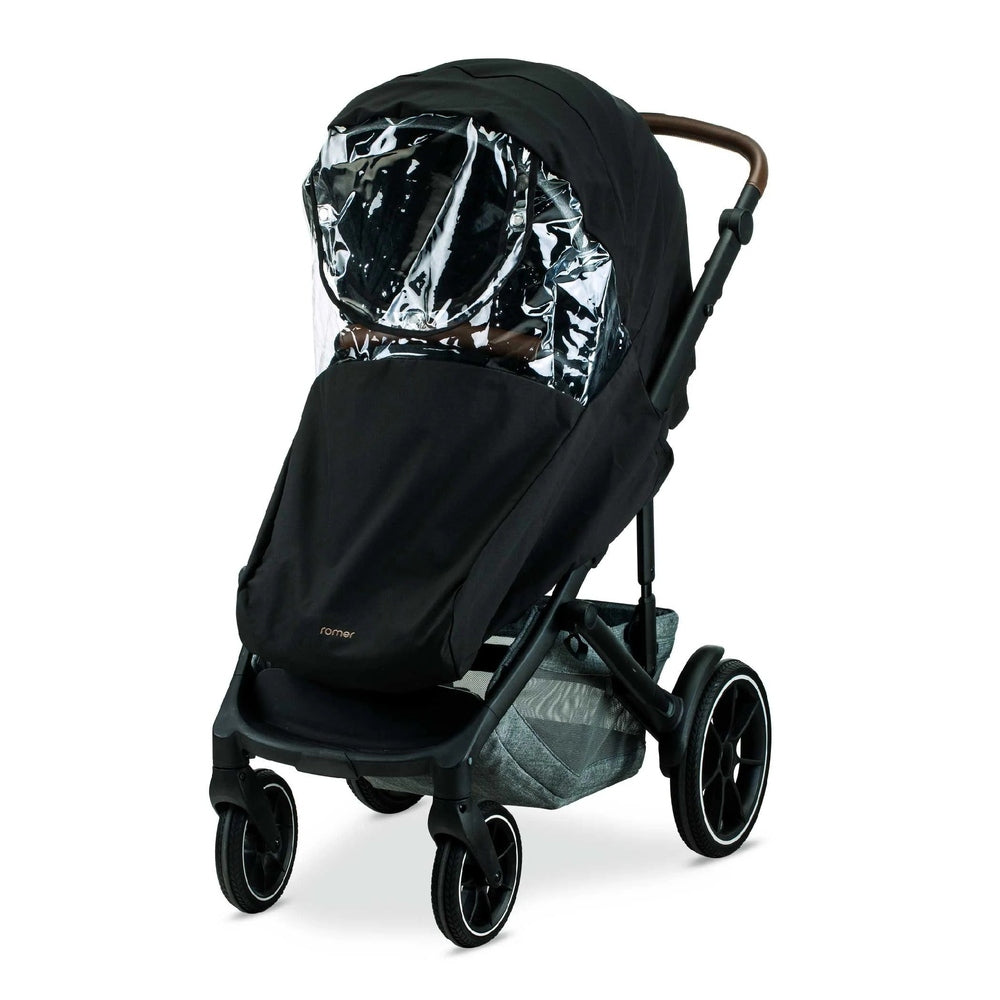 Romer Tura Rain Cover on a black Romer stroller, clear shield protecting the child from rain.