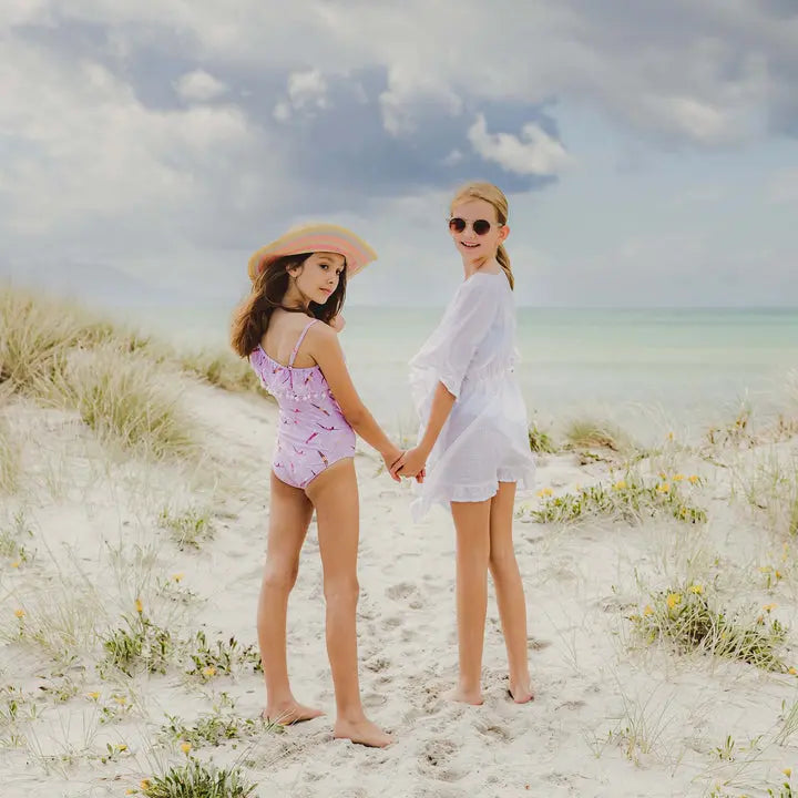 Snapper Rock white frilled cover up on girl at the beach