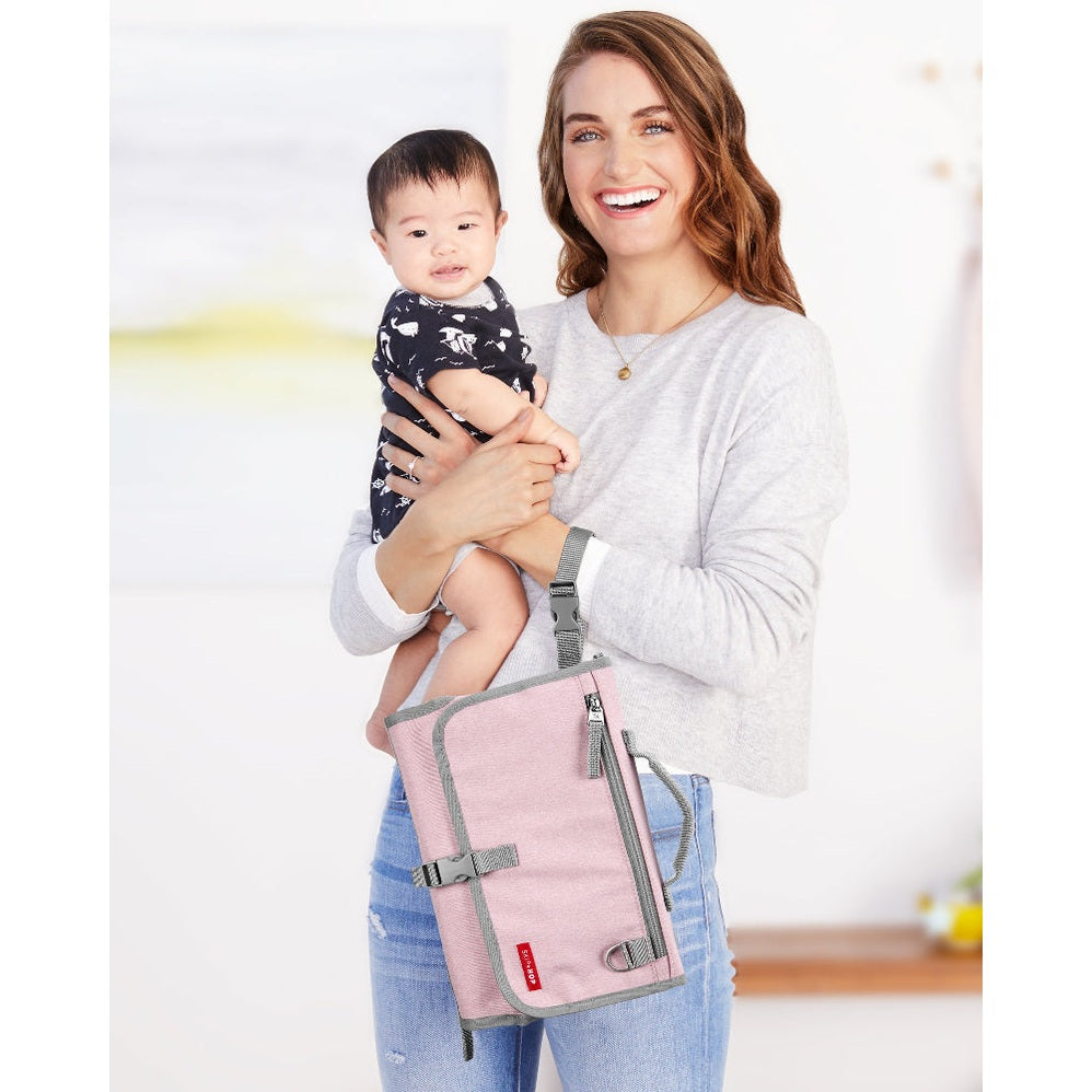 Skip Hop Pronto Signature Changing Station Pink Heather bag with gray trim and strap