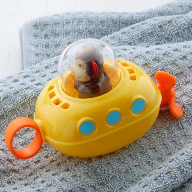 Skip Hop Zoo Pull & Go Submarine bath toy, yellow submarine with blue buttons, orange propellers and clear dome over a monkey figure