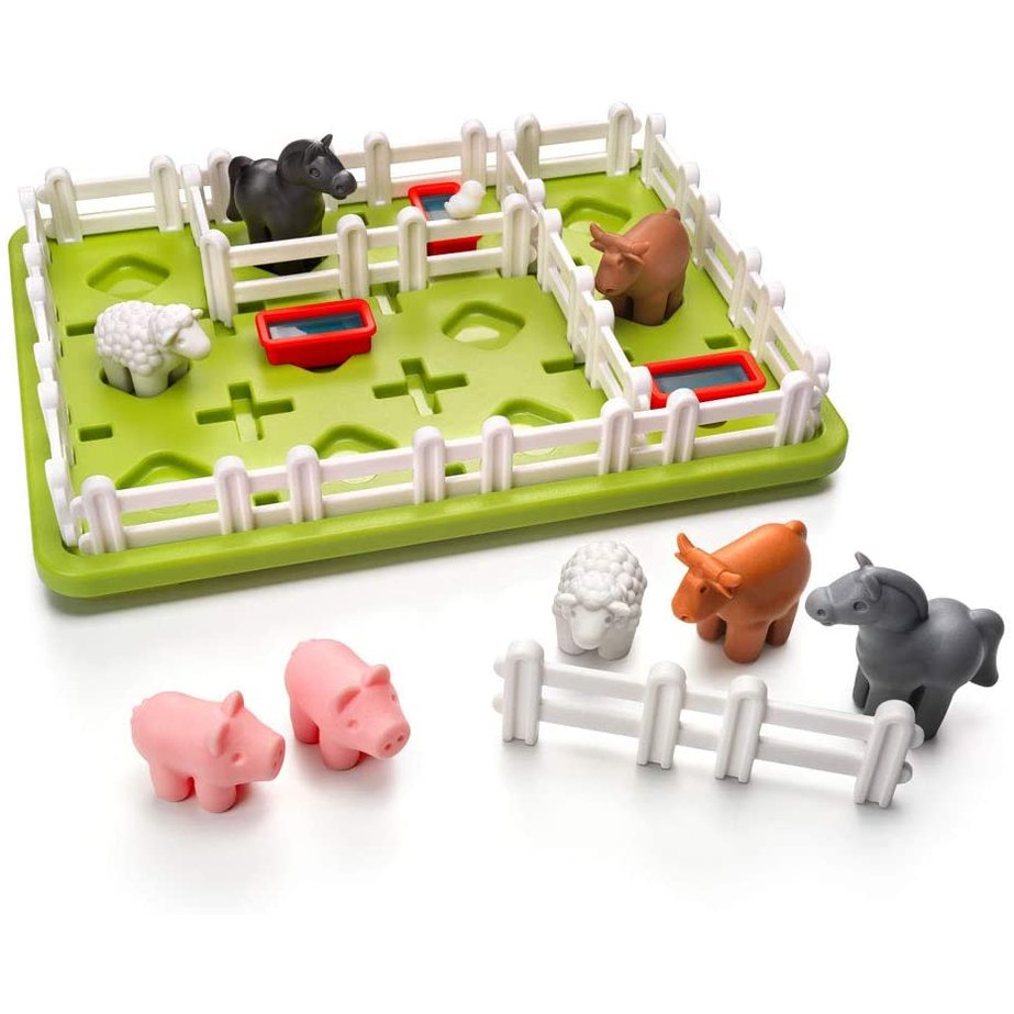 Smart Games Smart Farmer toy with green fenced play board, several animal figures and red feeding troughs