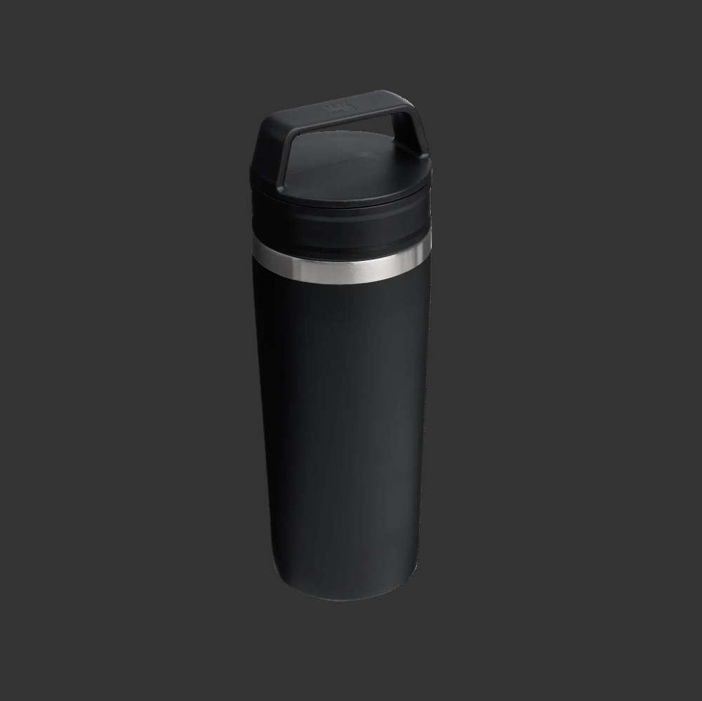 Black insulated tumbler with a silver band on a white background