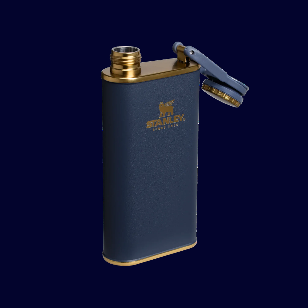 Stanley Classic Flask 8oz in navy with gold trim, cap swung open to reveal the twist lid.