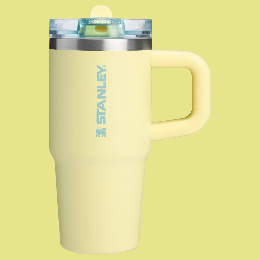 Stanley The Quencher Protour Flip Straw Tumbler 14 oz in pale yellow with a flip lid and easy-grip handle