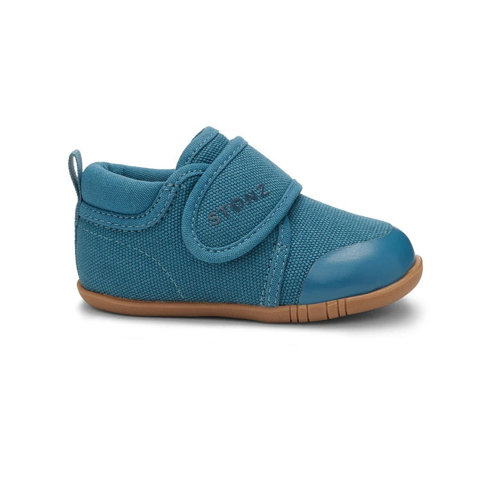 Stonz Cruiser Natural Baby Shoes Denim in blue denim with Velcro strap, highlighting secure fit and tan sole