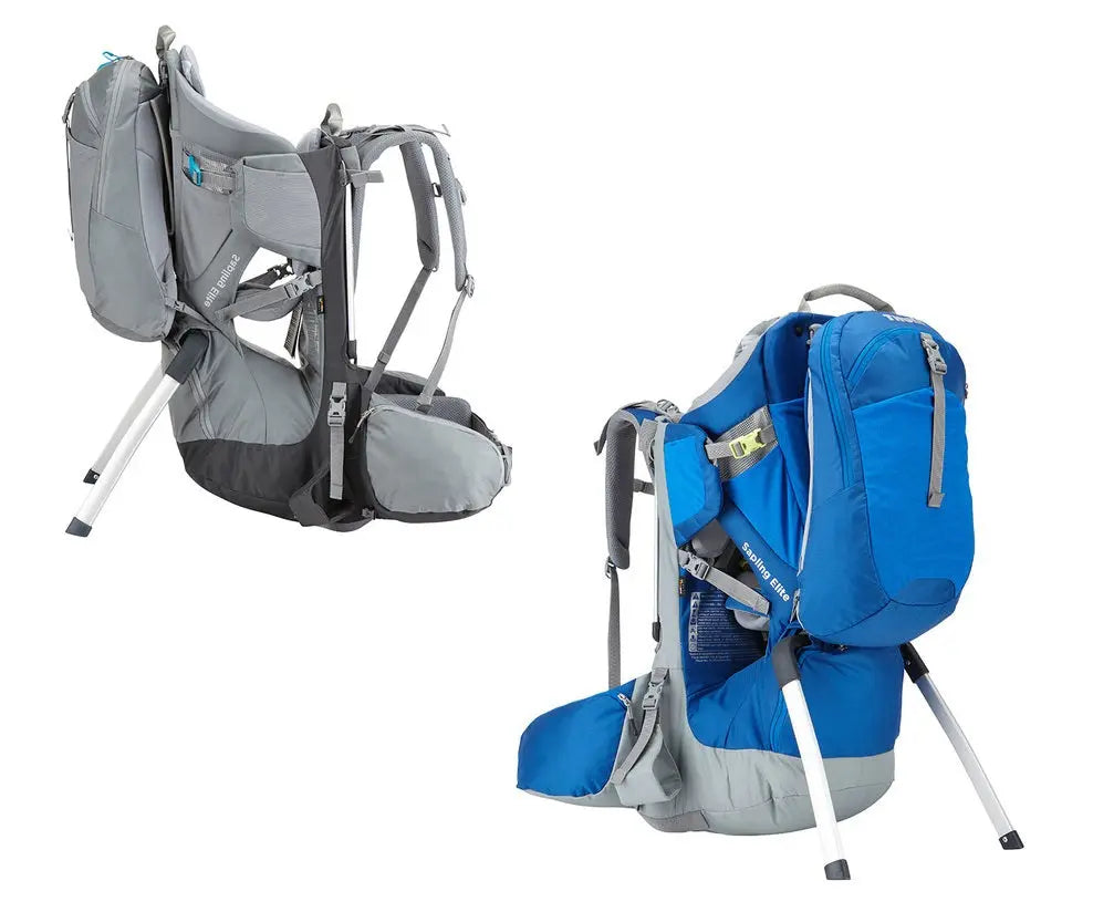 Thule Sapling Elite Child Carrier in grey/blue, showing aluminum frame and padded hip belts ready for use.